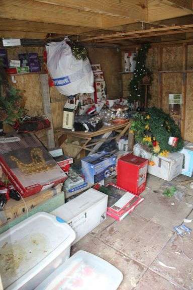 Contents of Left Side of Shed Being Townhome Figurines, Wreathes, Ornaments, Lights, Yard Decorations, and Misc Christmas Decorations image