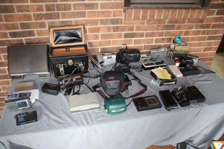 Polaroid, Sharp, Auto Star Cameras, Keystone Camcorder, Hamilton Radio, Cases, Batteries, and Misc image