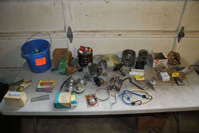 Pistons, Lock with Key, Lock Hinges, Ratchet Strap Piece, Milk Crate, Chalk Line, 5/16 in Staples, Lumber Nails, and Misc image