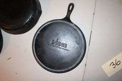 10.5 Inch Cast Iron Skillet, No.7 10.5 Inch Cast Iron Skillet, and Lodge 10.5 Inch Cast Iron Flat Top