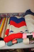 Various Colored Yarn, Afghans, and Blankets