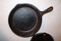 10.5 Inch Cast Iron Skillet, No.7 10.5 Inch Cast Iron Skillet, and Lodge 10.5 Inch Cast Iron Flat Top