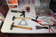 Ball Peen Hammer, Tool Kit, Speed Square, Claw Hammer, Caulk Gun, Pliers, Electrical Tester, Levels, Combination Wrenches, Tool Bags, and Misc.