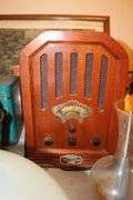 Cake Plate Carrier, Tins, Thomas Collector Edition Radio, Glass Canisters, Plastic Canisters, Framed Puzzle, Yard Stick, Books, and Misc.
