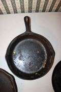 10.5 Inch Cast Iron Skillet, No.7 10.5 Inch Cast Iron Skillet, and Lodge 10.5 Inch Cast Iron Flat Top