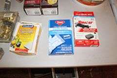 (2) Buckets of Base 2 Sealant, Bird Feeder, Rubber Tie Downs, Screws, Daisy 4x15 Scope, E Parker and Sons Fixed Blade Knife, Door Knobs, 18V Black and Decker Battery, and Misc.