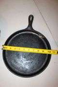 10.5 Inch Cast Iron Skillet, No.7 10.5 Inch Cast Iron Skillet, and Lodge 10.5 Inch Cast Iron Flat Top