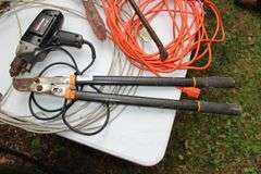 1/2 In Craftsman Drill, (2) Electrical Cords, Cable, 4 Way Tire Tool, Pruners, 2 Ton Floor Jack, Claw Hammer, Square, Crow Bar, Hand Saw, and Misc.