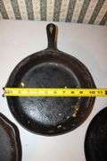 10.5 Inch Cast Iron Skillet, No.7 10.5 Inch Cast Iron Skillet, and Lodge 10.5 Inch Cast Iron Flat Top