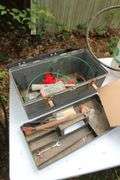 Plastic Tool Box with Tray, Lug Nuts, Nails, Claw Hammer, 6 Gallon Sprayer, Rope, and (2) Plastic Gas Cans, Propane Tank, and Misc.
