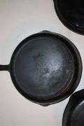 10.5 Inch Cast Iron Skillet, No.7 10.5 Inch Cast Iron Skillet, and Lodge 10.5 Inch Cast Iron Flat Top
