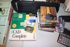 X-Acto Paper Cutter, Monopoly Games, Jigsaw Puzzles, Board Games, Wii Fit Board, Cassette Case, Cassettes, Sony Cam Recorder, Oculus VR Headset and Remote, and Misc.