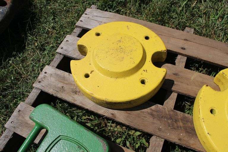 (5) 40 Lb. John Deere Tractor Weights, and (2) 50 Lb. John Deere Rear Wheel Weights