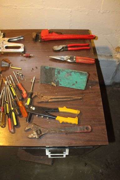 18 Inch Pipe Wrench, Screwdrivers, Rivet Gun, Adjustable Wrenches, Scissors, Staple Gun, Speed Square, 1/4 Inch Staples, and Misc.
