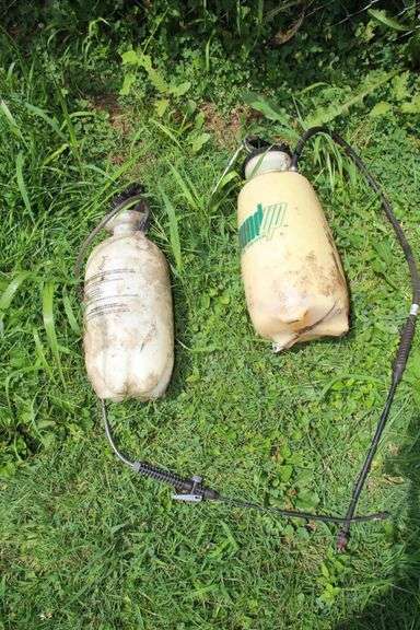 1 Gallon Gas Can, (2) 2 Gallon Gas Cans, 5 Gallon Gas Can, and (2) Sprayers