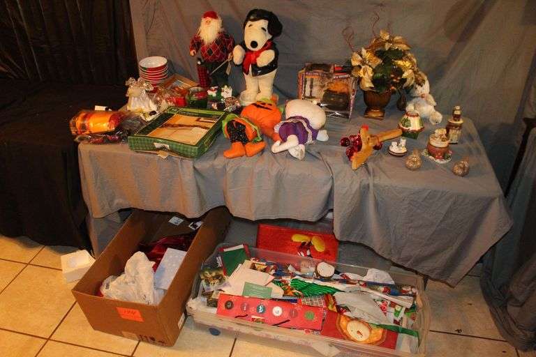 Christmas Wrapping Paper, Rubbermaid Slimfit Wheeled Underbed Box, Stuffed Snoopy, Santa Figurine, Stuffed Decorations, Gift Bags, Holiday Bowls, Angel Figurines, and Misc. Decorations