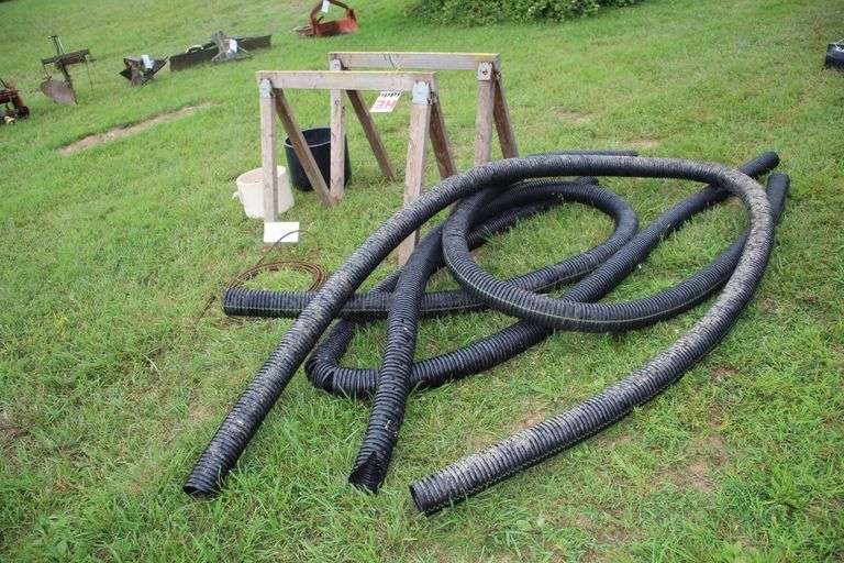 (2) Saw Horses, Cable, (2) Flower Pots, (4) Pieces of 4 Inch Drain Pipe, and Misc. Rope Pieces image