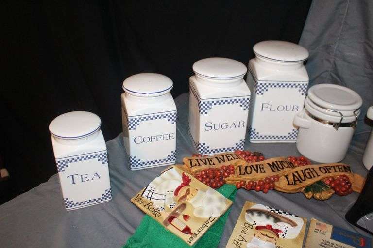 (4) Canisters with Sealing Lids, (4) Decorative Canisters, Wolf Statue, Alarm Clock, Wall Decorations, Tape Cleaner, and Misc.
