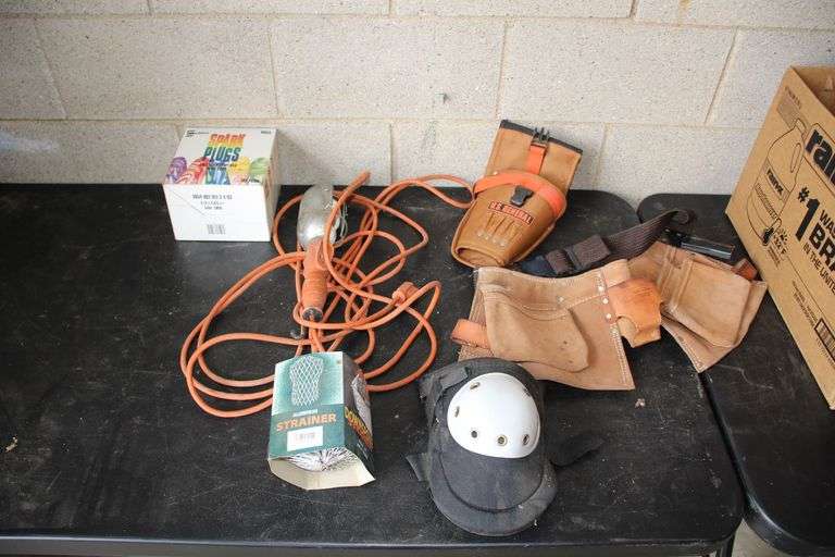 Box of Ear Plugs, Shop Light, Knee Pads, Tool Belts, and Downspout Strainer image