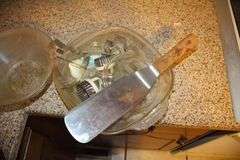 Pyrex Mixing Bowls, Plastic Measuring Cups, Glass Bowls, Strainer, (2) Sifters, Biscuit Cutters, and Misc.