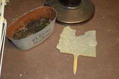 (2) Folding Cots, Standing Heater, Fan, Metal Flower Stand Bench, Kingsford Charcoal, and Type 1 Tile Adhesive