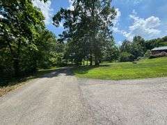 PARCEL 1: LOG HOME - BASEMENT - GARAGE - 1.2 ACRES: 487 Quiggins Lane, Leitchfield, KY 42754