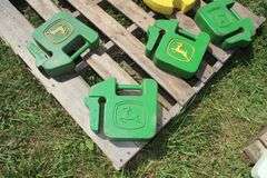 (5) 40 Lb. John Deere Tractor Weights, and (2) 50 Lb. John Deere Rear Wheel Weights