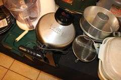 Cake Server, Bella Waffle Maker, Fry Basket, Frying Pans, Glass Cutting Boards, Fry Basket, Juicer, Popcorn Maker, Cake Mold, and Misc.