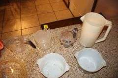 Pyrex Mixing Bowls, Plastic Measuring Cups, Glass Bowls, Strainer, (2) Sifters, Biscuit Cutters, and Misc.