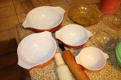 Pyrex Mixing Bowls, Plastic Measuring Cups, Glass Bowls, Strainer, (2) Sifters, Biscuit Cutters, and Misc.