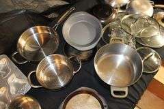 Farberware Skillets, Cuisinart Stainless Pots with Lids, Baking Pans, Metal Strainer, and Pyrex Baking Dish Carrier