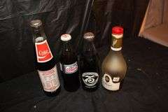 Drummer Figurine, Coasters, Soda Cans, and Misc. Glass Bottles