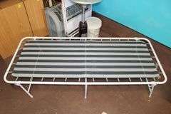(2) Folding Cots, Standing Heater, Fan, Metal Flower Stand Bench, Kingsford Charcoal, and Type 1 Tile Adhesive