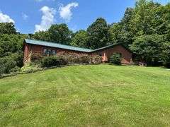 PARCEL 1: LOG HOME - BASEMENT - GARAGE - 1.2 ACRES: 487 Quiggins Lane, Leitchfield, KY 42754