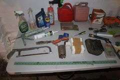 (2) Gas Cans, Yard Stick, Pliers, Screwdrivers, Hand Saw, Chicago Electric Jigsaw, Caulk Gun, and Misc.