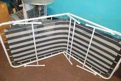 (2) Folding Cots, Standing Heater, Fan, Metal Flower Stand Bench, Kingsford Charcoal, and Type 1 Tile Adhesive