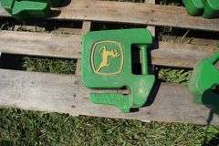 (5) 40 Lb. John Deere Tractor Weights, and (2) 50 Lb. John Deere Rear Wheel Weights
