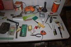 (2) Gas Cans, Yard Stick, Pliers, Screwdrivers, Hand Saw, Chicago Electric Jigsaw, Caulk Gun, and Misc.