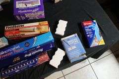 Reynolds Wrap, Swiffer Pads, Mr. Clean Magic Erasers, Pack Mate Vacu-Seal, Size Medium Rubber Gloves, and Misc.