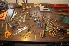18 Inch Pipe Wrench, Screwdrivers, Rivet Gun, Adjustable Wrenches, Scissors, Staple Gun, Speed Square, 1/4 Inch Staples, and Misc.