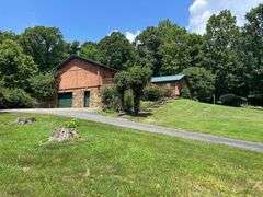 PARCEL 1: LOG HOME - BASEMENT - GARAGE - 1.2 ACRES: 487 Quiggins Lane, Leitchfield, KY 42754