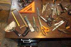 18 Inch Pipe Wrench, Screwdrivers, Rivet Gun, Adjustable Wrenches, Scissors, Staple Gun, Speed Square, 1/4 Inch Staples, and Misc.