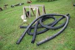 (2) Saw Horses, Cable, (2) Flower Pots, (4) Pieces of 4 Inch Drain Pipe, and Misc. Rope Pieces