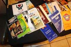 Keurig Coffee Maker, Stainless Knife Set, Cook Books, Glass Cutting Board, Back Scratcher, Shower Hooks, and Misc.
