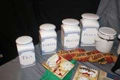 (4) Canisters with Sealing Lids, (4) Decorative Canisters, Wolf Statue, Alarm Clock, Wall Decorations, Tape Cleaner, and Misc.