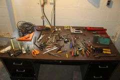 18 Inch Pipe Wrench, Screwdrivers, Rivet Gun, Adjustable Wrenches, Scissors, Staple Gun, Speed Square, 1/4 Inch Staples, and Misc.