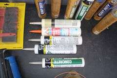 Caulk, Caulk Guns, Brushes, Taping Knives, Dust Pans, Sand Paper, Blades, and Misc.