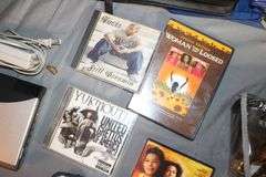 DVD Cases, Belmont Binoculars, Kodak Record Player, DVD Player, Clock Radio, Headphones, Camera Bag, and Misc.