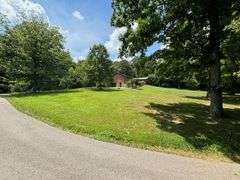 PARCEL 1: LOG HOME - BASEMENT - GARAGE - 1.2 ACRES: 487 Quiggins Lane, Leitchfield, KY 42754