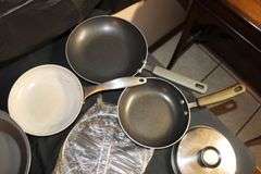 Farberware Skillets, Cuisinart Stainless Pots with Lids, Baking Pans, Metal Strainer, and Pyrex Baking Dish Carrier